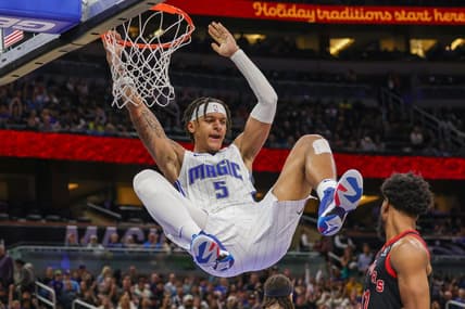Dec 9, 2022; Orlando, Florida, USA; Orlando Magic forward Paolo Banchero (5) dunks the ball during the second half against the Toronto Raptors at Amway Center. Mandatory Credit: Mike Watters-USA TODAY Sports