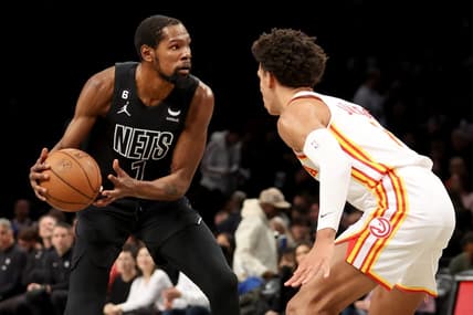 Dec 9, 2022; Brooklyn, New York, USA; Brooklyn Nets forward Kevin Durant (7) controls the ball against Atlanta Hawks forward Jalen Johnson (1) during the third quarter at Barclays Center. Mandatory Credit: Brad Penner-USA TODAY Sports