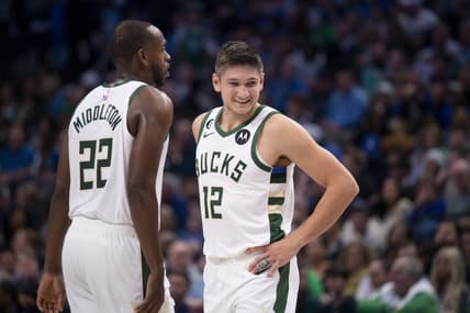 Dec 9, 2022; Dallas, Texas, USA; Milwaukee Bucks forward Khris Middleton (22) and guard Grayson Allen (12) smile during the second half against the Dallas Mavericks at the American Airlines Center. Mandatory Credit: Jerome Miron-USA TODAY Sports