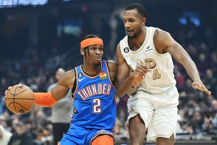 Dec 10, 2022; Cleveland, Ohio, USA; Oklahoma City Thunder guard Shai Gilgeous-Alexander (2) drives to the basket against Cleveland Cavaliers forward Evan Mobley (4) during the first half at Rocket Mortgage FieldHouse. Mandatory Credit: Ken Blaze-USA TODAY Sports