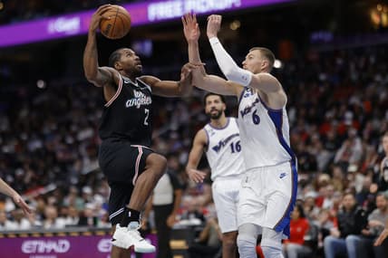 Dec 10, 2022; Washington, District of Columbia, USA; Los Angeles Clippers forward Kawhi Leonard (2) shoots the ball as Washington Wizards center Kristaps Porzingis (6) defends in the fourth quarter at Capital One Arena. Mandatory Credit: Geoff Burke-USA TODAY Sports