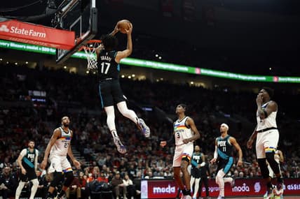 Dec 10, 2022; Portland, Oregon, USA; Portland Trail Blazers shooting guard Shaedon Sharpe (17) dunks the ball during the first half against the Minnesota Timberwolves at Moda Center. Mandatory Credit: Soobum Im-USA TODAY Sports