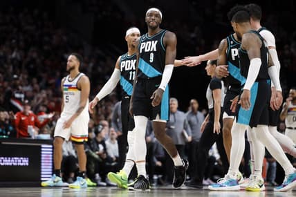 Dec 10, 2022; Portland, Oregon, USA; Portland Trail Blazers shooting guard Josh Hart (11), Jerami Grant (9),  Anfernee Simons (2nd from right), and Damian Lillard (0, right) walk to the bench for a time out during the second half against the Minnesota Timberwolves at Moda Center. Mandatory Credit: Soobum Im-USA TODAY Sports