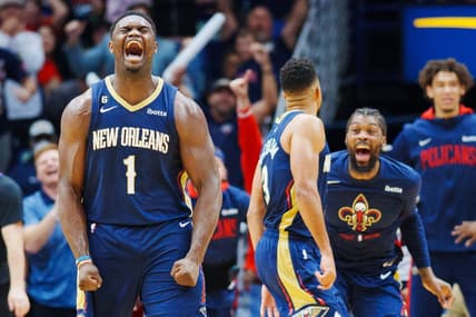 Dec 11, 2022; New Orleans, Louisiana, USA; New Orleans Pelicans forward Zion Williamson (1) reacts to a dunk by guard CJ McCollum (3) during the third quarter against the Phoenix Suns at Smoothie King Center. Mandatory Credit: Andrew Wevers-USA TODAY Sports
