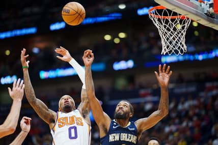Dec 11, 2022; New Orleans, Louisiana, USA; New Orleans Pelicans forward Naji Marshall (8) and Phoenix Suns forward Torrey Craig (0) fight for a rebound during overtime at Smoothie King Center. Mandatory Credit: Andrew Wevers-USA TODAY Sports