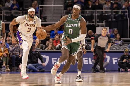 Dec 11, 2022; Detroit, Michigan, USA; Detroit Pistons center Jalen Duren (0) moves the ball up court in front of Los Angeles Lakers forward Anthony Davis (3) during the in the first half at Little Caesars Arena. Mandatory Credit: David Reginek-USA TODAY Sports
