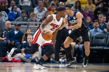 Dec 12, 2022; Indianapolis, Indiana, USA; Miami Heat forward Jimmy Butler (22) dribbles the ball while Indiana Pacers guard Andrew Nembhard (2) defends in the second quarter at Gainbridge Fieldhouse. Mandatory Credit: Trevor Ruszkowski-USA TODAY Sports