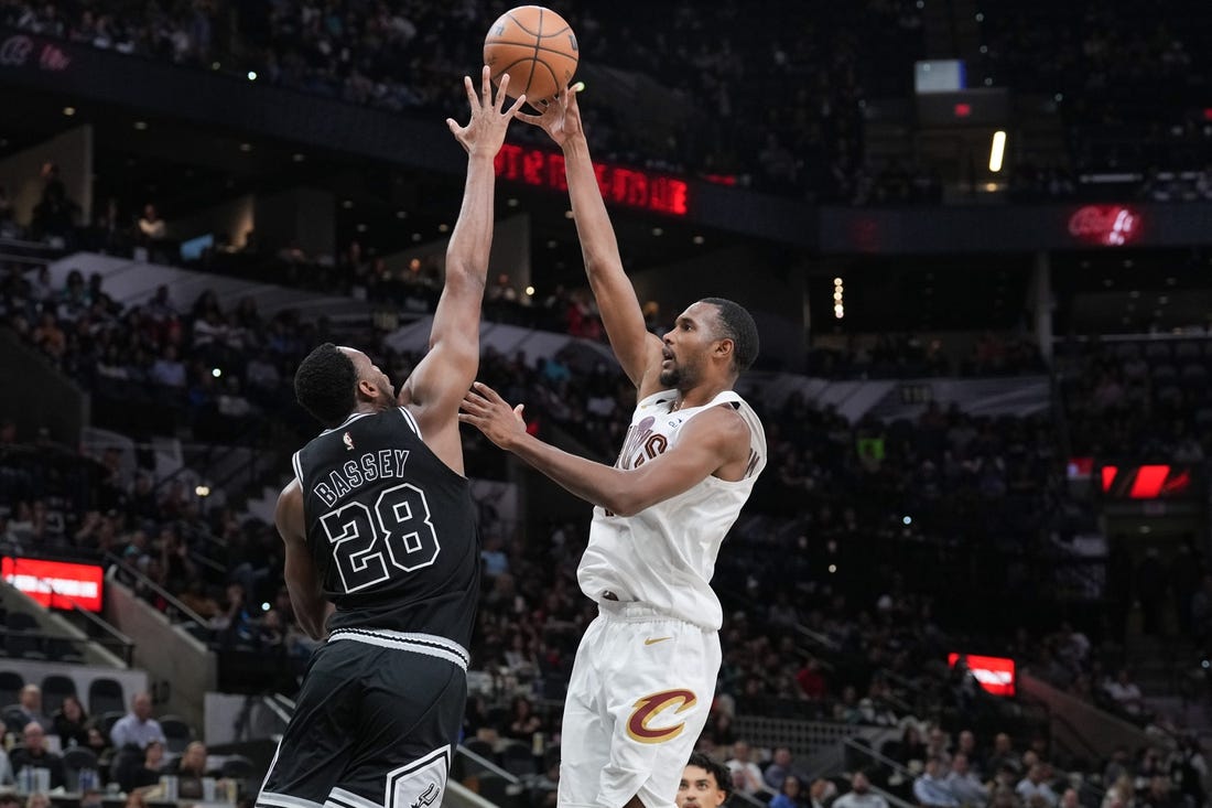 Dec 12, 2022; San Antonio, Texas, USA; Cleveland Cavaliers forward Evan Mobley (4) shoots over San Antonio Spurs center Charles Bassey (28) in the second half at the AT&T Center. Mandatory Credit: Daniel Dunn-USA TODAY Sports