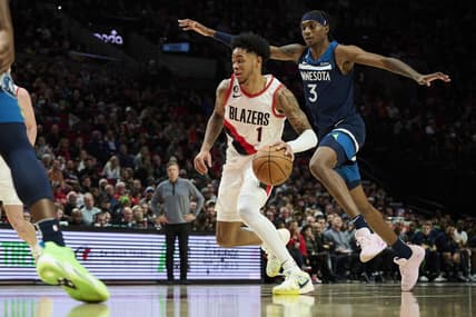 Dec 12, 2022; Portland, Oregon, USA;  Portland Trail Blazers guard Anfernee Simons (1) drives to the basket during the first half against Minnesota Timberwolves forward Jaden McDaniels (3) at Moda Center. Mandatory Credit: Troy Wayrynen-USA TODAY Sports