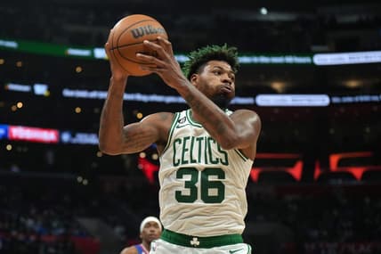 Dec 12, 2022; Los Angeles, California, USA; Boston Celtics guard Marcus Smart (36) rebounds the ball against the LA Clippers in the second half at Crypto.com Arena. The Clippers defeated the Celtics 113-93. Mandatory Credit: Kirby Lee-USA TODAY Sports