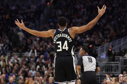 Dec 13, 2022; Milwaukee, Wisconsin, USA;  Milwaukee Bucks forward Giannis Antetokounmpo (34) reacts after scoring a 3 point basket during the fourth quarter against the Golden State Warriors at Fiserv Forum. Mandatory Credit: Jeff Hanisch-USA TODAY Sports