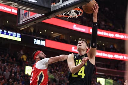 Dec 13, 2022; Salt Lake City, Utah, USA; Utah Jazz center Walker Kessler (24) lays the ball up against New Orleans Pelicans forward Larry Nance Jr. (22) in the second quarter at Vivint Arena. Mandatory Credit: Rob Gray-USA TODAY Sports