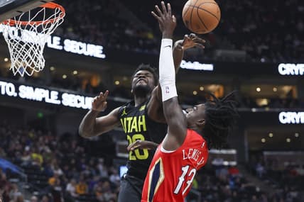 Dec 13, 2022; Salt Lake City, Utah, USA; Utah Jazz center Udoka Azubuike (20) blocks the shot of New Orleans Pelicans guard Kira Lewis Jr. (13) in the second half at Vivint Arena. Mandatory Credit: Rob Gray-USA TODAY Sports