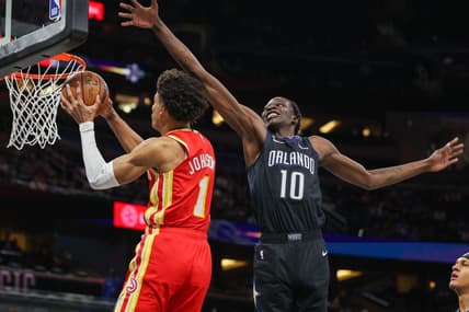 Dec 14, 2022; Orlando, Florida, USA;  Atlanta Hawks forward Jalen Johnson (1) dunks the ball past Orlando Magic center Bol Bol (10) in the first quarter at Amway Center. Mandatory Credit: Nathan Ray Seebeck-USA TODAY Sports