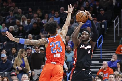 Dec 14, 2022; Oklahoma City, Oklahoma, USA; Miami Heat guard Victor Oladipo (4) shoots over Oklahoma City Thunder guard Tre Mann (23) during the second quarter at Paycom Center. Mandatory Credit: Alonzo Adams-USA TODAY Sports