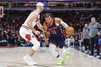 Dec 14, 2022; Chicago, Illinois, USA; New York Knicks guard Jalen Brunson (11) drives to the basket against Chicago Bulls guard Alex Caruso (6) during overtime at United Center. Mandatory Credit: Kamil Krzaczynski-USA TODAY Sports