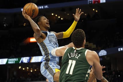Dec 15, 2022; Memphis, Tennessee, USA; Memphis Grizzlies guard Ja Morant (12) shoots during the first half against the Milwaukee Bucks at FedExForum. Mandatory Credit: Petre Thomas-USA TODAY Sports