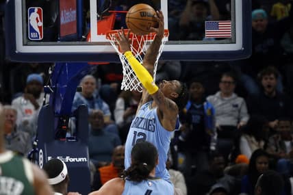 Dec 15, 2022; Memphis, Tennessee, USA; Memphis Grizzlies guard Ja Morant (12) dunks during the second half against the Milwaukee Bucks at FedExForum. Mandatory Credit: Petre Thomas-USA TODAY Sports