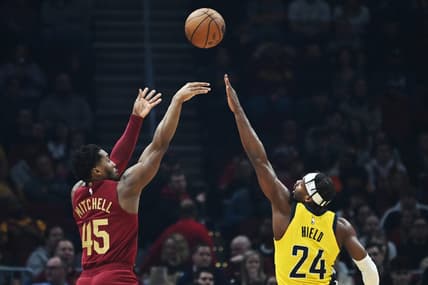 Dec 16, 2022; Cleveland, Ohio, USA; Cleveland Cavaliers guard Donovan Mitchell (45) shoots over the defense of Indiana Pacers guard Buddy Hield (24) during the first half at Rocket Mortgage FieldHouse. Mandatory Credit: Ken Blaze-USA TODAY Sports