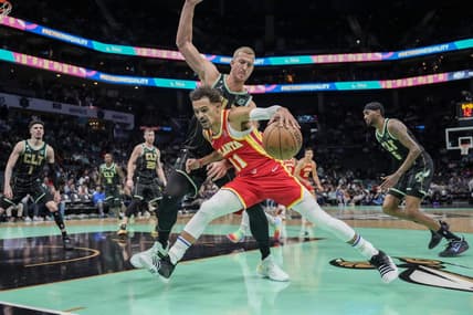 Dec 16, 2022; Charlotte, North Carolina, USA;  Atlanta Hawks guard Trae Young (11) drives to the basket against Charlotte Hornets center Mason Plumlee (24) during first quarter at Spectrum Center. Mandatory Credit: Jim Dedmon-USA TODAY Sports