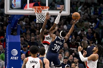 Dec 16, 2022; Dallas, Texas, USA; Dallas Mavericks guard Kemba Walker (34) shoots over Portland Trail Blazers forward Jerami Grant (9) during the second quarter at the American Airlines Center. Mandatory Credit: Jerome Miron-USA TODAY Sports