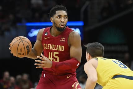 Dec 16, 2022; Cleveland, Ohio, USA; Cleveland Cavaliers guard Donovan Mitchell (45) controls the ball against Indiana Pacers guard T.J. McConnell (9) during the second half at Rocket Mortgage FieldHouse. Mandatory Credit: Ken Blaze-USA TODAY Sports