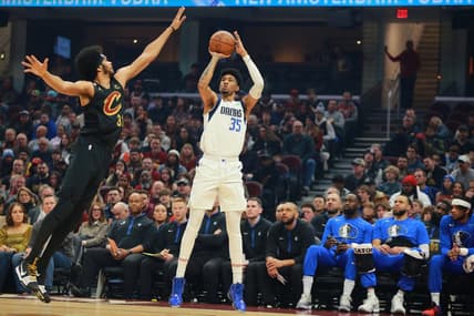 Dec 17, 2022; Cleveland, Ohio, USA;  Dallas Mavericks forward Christian Wood (35) shoots the ball against Cleveland Cavaliers center Jarrett Allen (31) during the first quarter at Rocket Mortgage FieldHouse. Mandatory Credit: Aaron Josefczyk-USA TODAY Sports