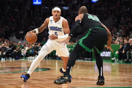 Dec 18, 2022; Boston, Massachusetts, USA;  Orlando Magic forward Paolo Banchero (5) controls the ball while Boston Celtics center Al Horford (42) during the first half at TD Garden. Mandatory Credit: Bob DeChiara-USA TODAY Sports
