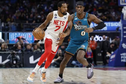 Dec 18, 2022; Detroit, Michigan, USA; Brooklyn Nets forward Kevin Durant (7) dribbles on Detroit Pistons center Jalen Duren (0) in the first half at Little Caesars Arena. Mandatory Credit: Rick Osentoski-USA TODAY Sports