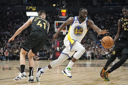 Dec 18, 2022; Toronto, Ontario, CAN; Golden State Warriors forward Draymond Green (23) drives to the net past Toronto Raptors forward Juancho Hernangomez (41) during the first half at Scotiabank Arena. Mandatory Credit: John E. Sokolowski-USA TODAY Sports