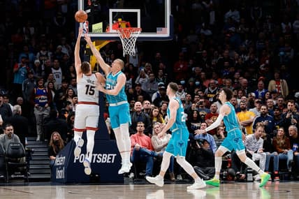 Dec 18, 2022; Denver, Colorado, USA; Denver Nuggets center Nikola Jokic (15) drives to the net against Charlotte Hornets center Mason Plumlee (24) as forward Gordon Hayward (20) and guard LaMelo Ball (1) defend in the first quarter at Ball Arena. Mandatory Credit: Isaiah J. Downing-USA TODAY Sports