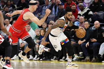 Dec 18, 2022; Minneapolis, Minnesota, USA; Minnesota Timberwolves guard D'Angelo Russell (0) dribbles while Chicago Bulls guard Alex Caruso (6) defends during the second quarter at Target Center. Mandatory Credit: Matt Krohn-USA TODAY Sports