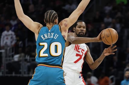 Dec 18, 2022; Detroit, Michigan, USA; Brooklyn Nets forward Kevin Durant (7) passes defended by Detroit Pistons forward Kevin Knox II (20) in the first half at Little Caesars Arena. Mandatory Credit: Rick Osentoski-USA TODAY Sports