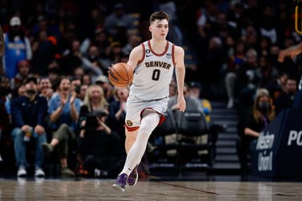 Dec 18, 2022; Denver, Colorado, USA; Denver Nuggets guard Christian Braun (0) dribbles the ball up court in the fourth quarter against the Charlotte Hornets at Ball Arena. Mandatory Credit: Isaiah J. Downing-USA TODAY Sports
