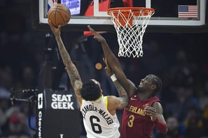 Dec 19, 2022; Cleveland, Ohio, USA; Utah Jazz guard Nickeil Alexander-Walker (6) shoots beside Cleveland Cavaliers guard Caris LeVert (3) in the second quarter at Rocket Mortgage FieldHouse. Mandatory Credit: David Richard-USA TODAY Sports