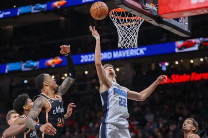 Dec 19, 2022; Atlanta, Georgia, USA; Orlando Magic forward Franz Wagner (22) reaches for a rebound against the Atlanta Hawks in the second quarter at State Farm Arena. Mandatory Credit: Brett Davis-USA TODAY Sports
