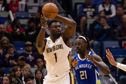 Dec 19, 2022; New Orleans, Louisiana, USA; New Orleans Pelicans forward Zion Williamson (1) looks to pass the ball against Milwaukee Bucks guard Jrue Holiday (21) during the second half at Smoothie King Center. Mandatory Credit: Stephen Lew-USA TODAY Sports