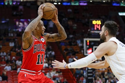 Dec 20, 2022; Miami, Florida, USA; Chicago Bulls forward DeMar DeRozan (11) protects the basketball from Miami Heat guard Max Strus (31) during the first quarter at FTX Arena. Mandatory Credit: Sam Navarro-USA TODAY Sports