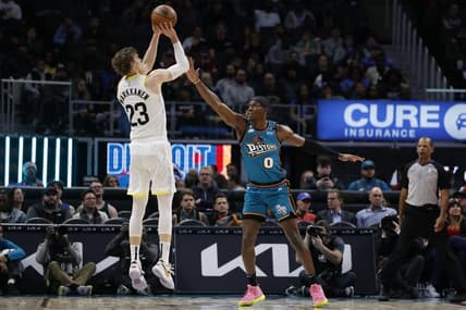 Dec 20, 2022; Detroit, Michigan, USA;  Utah Jazz forward Lauri Markkanen (23) shoots over Detroit Pistons center Jalen Duren (0) in the first half at Little Caesars Arena. Mandatory Credit: Rick Osentoski-USA TODAY Sports