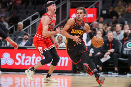 Dec 21, 2022; Atlanta, Georgia, USA; Atlanta Hawks guard Trae Young (11) drives on Chicago Bulls guard Alex Caruso (6) in the first quarter at State Farm Arena. Mandatory Credit: Brett Davis-USA TODAY Sports