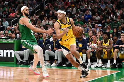 Dec 21, 2022; Boston, Massachusetts, USA; Indiana Pacers guard Andrew Nembhard (2) drives to the basket against Boston Celtics guard Derrick White (9) during the second quarter at the TD Garden. Mandatory Credit: Brian Fluharty-USA TODAY Sports
