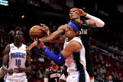 Dec 21, 2022; Houston, Texas, USA; Orlando Magic forward Paolo Banchero (5) and Houston Rockets forward Jabari Smith Jr. (1) battle for a rebound during the first quarter at Toyota Center. Mandatory Credit: Erik Williams-USA TODAY Sports