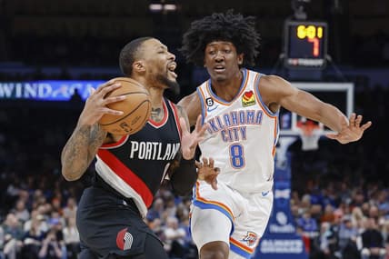 Dec 21, 2022; Oklahoma City, Oklahoma, USA; Portland Trail Blazers guard Damian Lillard (0) is defended by Oklahoma City Thunder forward Jalen Williams (8) on a drive during the second quarter at Paycom Center. Mandatory Credit: Alonzo Adams-USA TODAY Sports