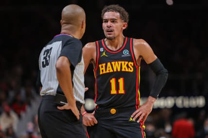 Dec 21, 2022; Atlanta, Georgia, USA; Atlanta Hawks guard Trae Young (11) talks to referee Sean Corbin (33) against the Chicago Bulls in the second half at State Farm Arena. Mandatory Credit: Brett Davis-USA TODAY Sports