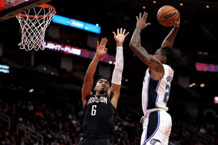Dec 21, 2022; Houston, Texas, USA; Orlando Magic forward Admiral Schofield (25) attempts a slam dunk while Houston Rockets forward KJ Martin (6) defends during the fourth quarter at Toyota Center. Mandatory Credit: Erik Williams-USA TODAY Sports