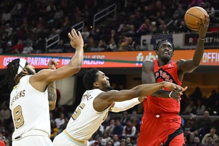 Dec 23, 2022; Cleveland, Ohio, USA; Toronto Raptors forward Pascal Siakam (43) drives to the basket beside Cleveland Cavaliers guard Donovan Mitchell (45) and forward Lamar Stevens (8) in the second quarter at Rocket Mortgage FieldHouse. Mandatory Credit: David Richard-USA TODAY Sports