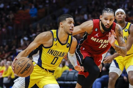 Dec 23, 2022; Miami, Florida, USA; Indiana Pacers guard Tyrese Haliburton (0) drives to the basket ahead of Miami Heat forward Caleb Martin (16) during the third quarter at FTX Arena. Mandatory Credit: Sam Navarro-USA TODAY Sports