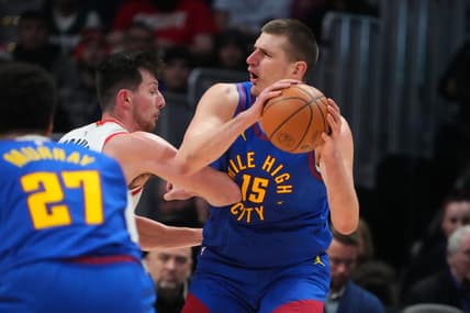 Dec 23, 2022; Denver, Colorado, USA; Portland Trail Blazers forward Drew Eubanks (24) elbows Denver Nuggets center Nikola Jokic (15) in the second half at Ball Arena. Mandatory Credit: Ron Chenoy-USA TODAY Sports