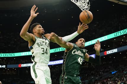 Dec 25, 2022; Boston, Massachusetts, USA; Boston Celtics center Al Horford (42) fouls Milwaukee Bucks power forward Giannis Antetokounmpo (34) attempting a shot during the second half at TD Garden. Mandatory Credit: Gregory Fisher-USA TODAY Sports