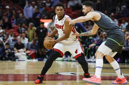 Dec 26, 2022; Miami, Florida, USA; Miami Heat guard Kyle Lowry (7) protects the ball from Minnesota Timberwolves guard Austin Rivers (25) during the first quarter at FTX Arena. Mandatory Credit: Sam Navarro-USA TODAY Sports